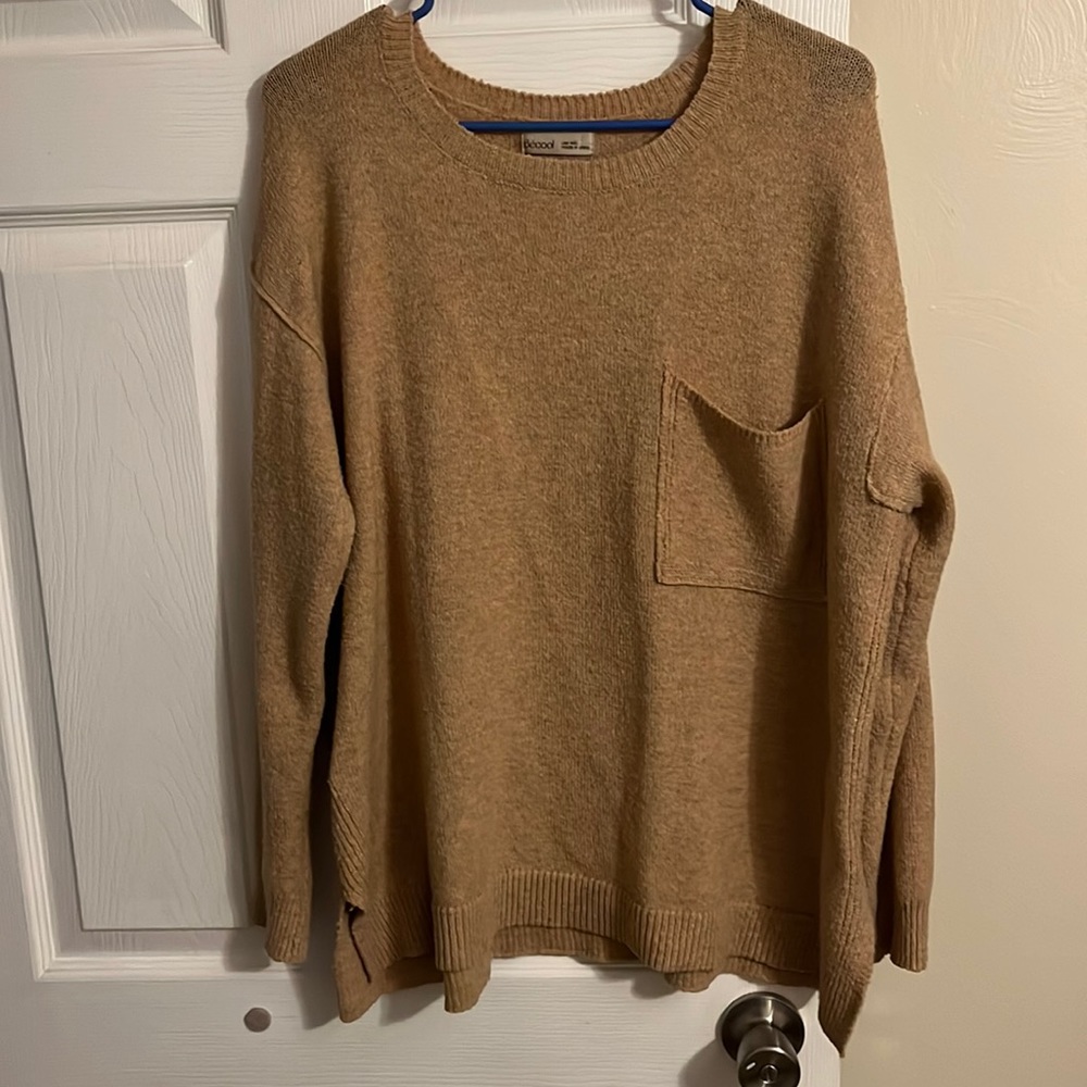 mustard yellow sweater with hints of speckled colors to contrast.